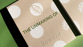 A close up shot of a book cover with a green background, the cover reads 'the unmaking of' and has kowtow embossed bottom center.