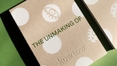 A close up shot of a book cover with a green background, the cover reads 'the unmaking of' and has kowtow embossed bottom center.