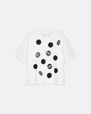 A white short-sleeve t-shirt with a black graphic print of various circular and geometric motifs, displayed on a light gray background.