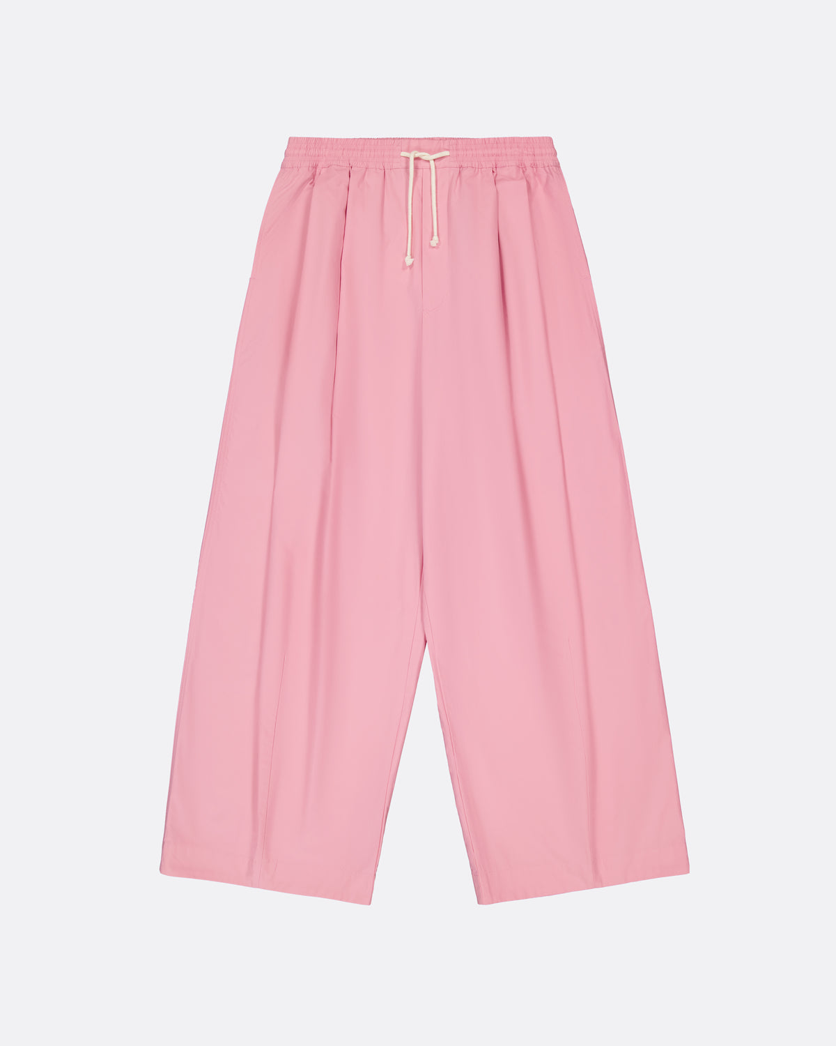 A pair of wide-leg, pleated pink pants with an elastic waistband and a white drawstring, shown flat against a light gray background.