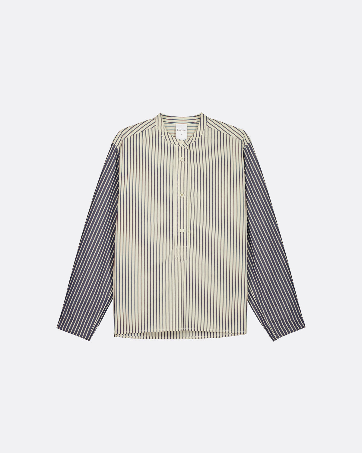 A long-sleeve button-up shirt with a beige and white vertically striped body and solid dark gray sleeves, displayed flat against a light gray background.