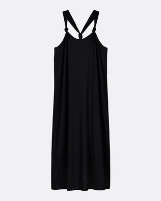 A black sleeveless slip dress with thin shoulder straps that cross at the back, shown against a plain light gray background.